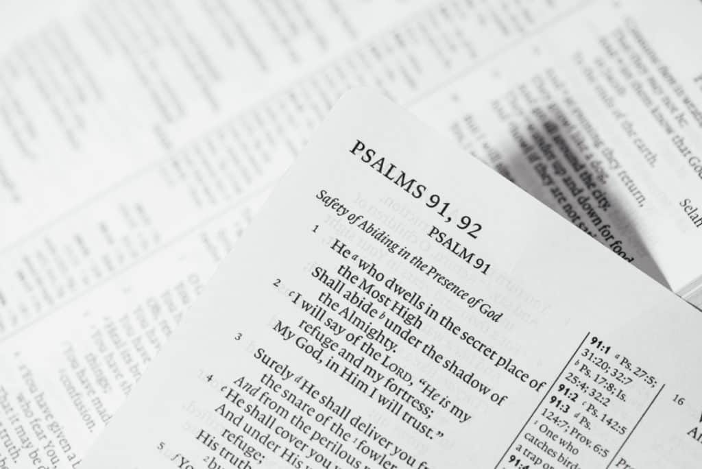 A page from the Bible that shows the corner where the verse reference is visible
